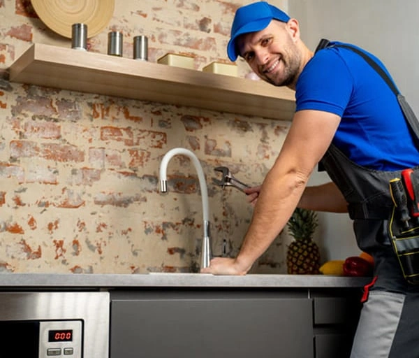 img-smiling-plumber-fixing-kitchen-faucet-drain-inspection